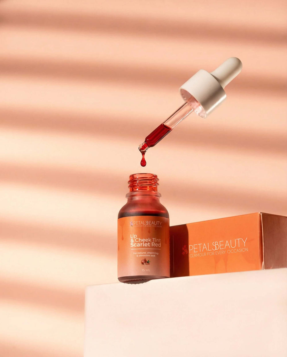 Scarlet Red lip and cheek tint bottle showing deep red formula