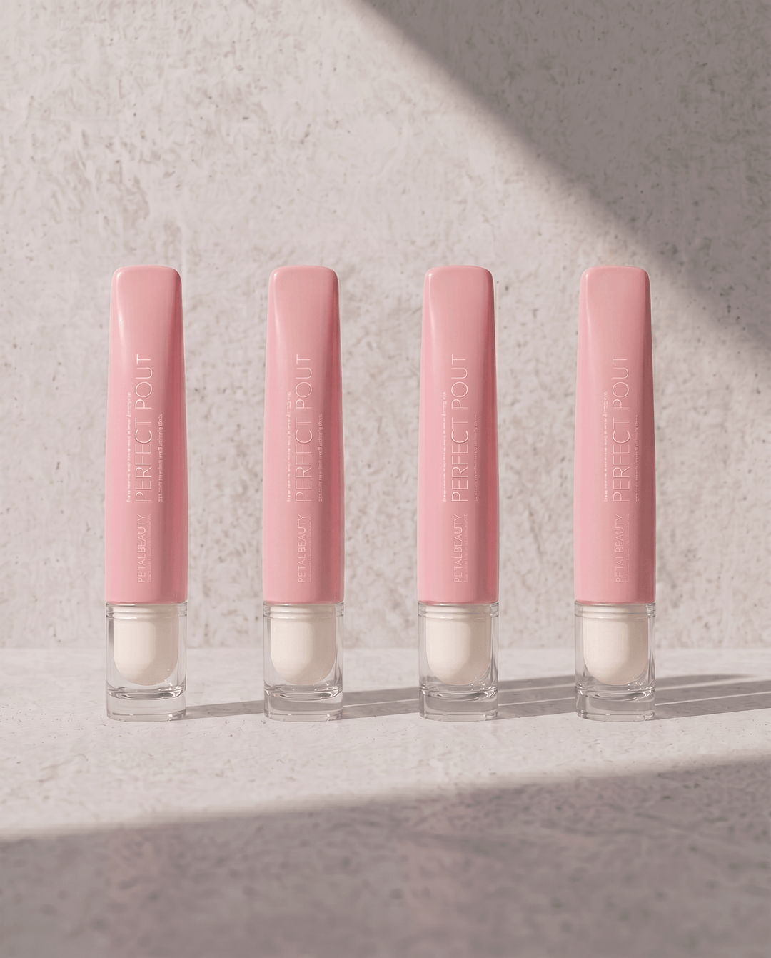 Perfect Pout bundle lip gloss shades shown with their applicators