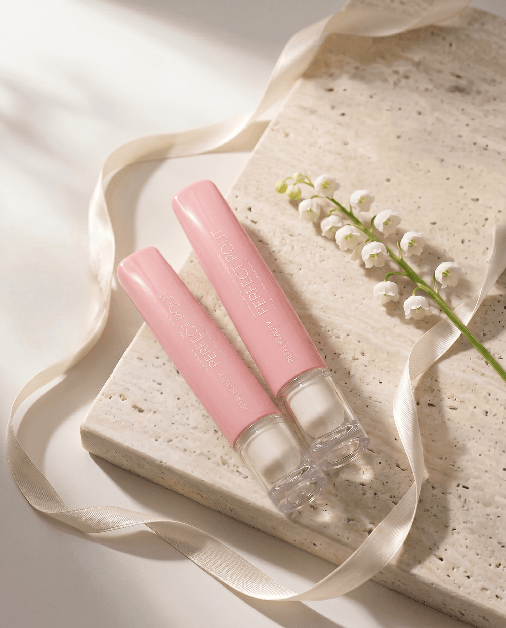 Two Perfect Pout lip glosses from the two-gloss bundle by Petals Beauty