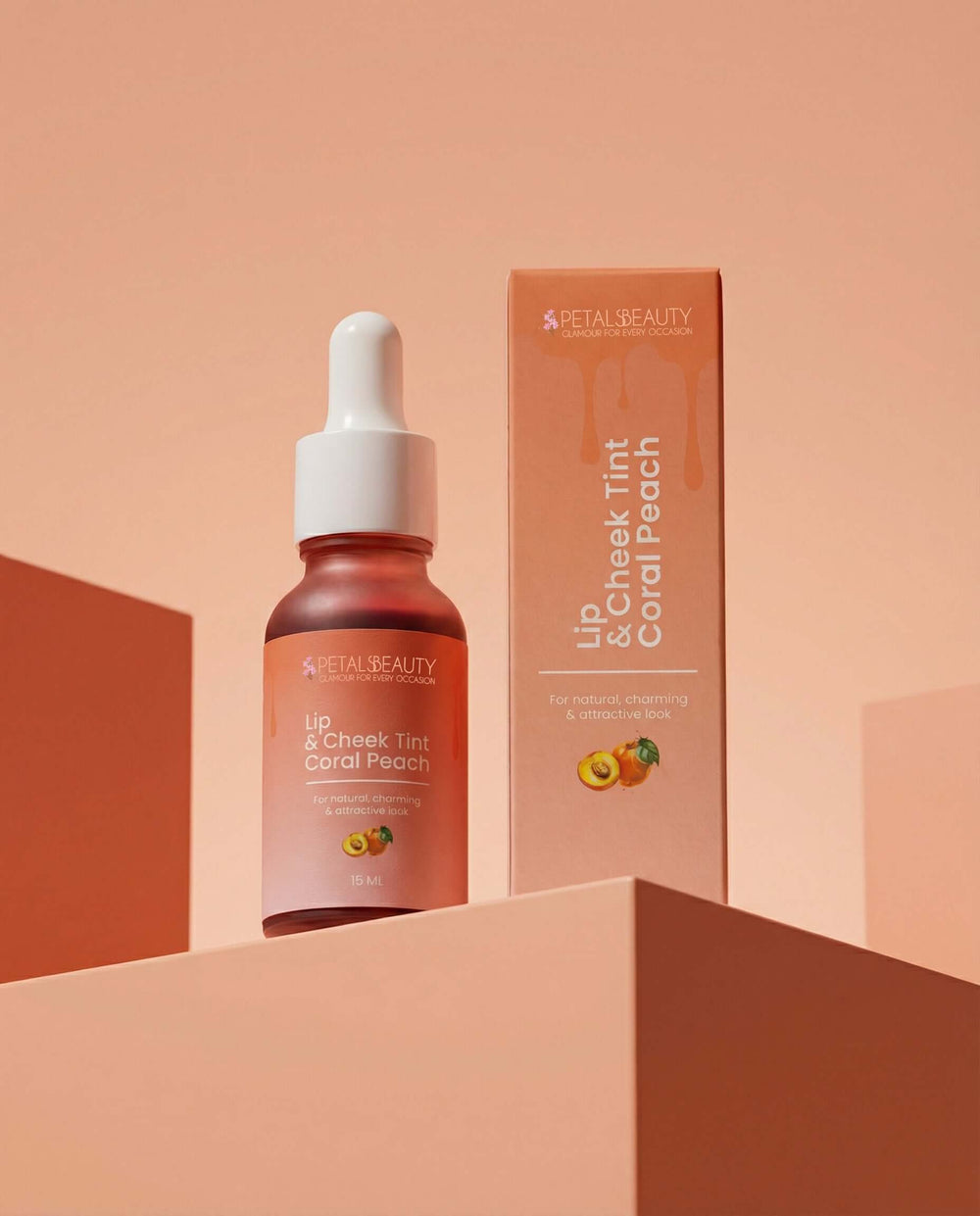 Coral Peach lip and cheek tint bottle with warm coral formula