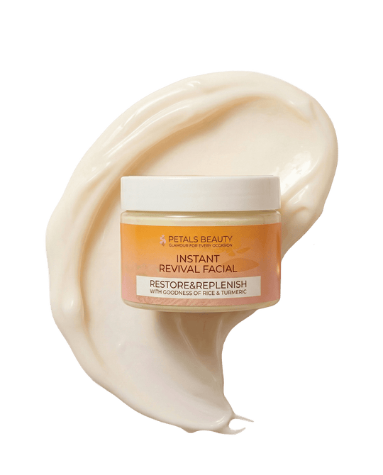 A jar of Petals Beauty Instant Revival Facial Restore & Replenish cream, set against a stylized swirl of the off-white facial cream itself on a clean white background.