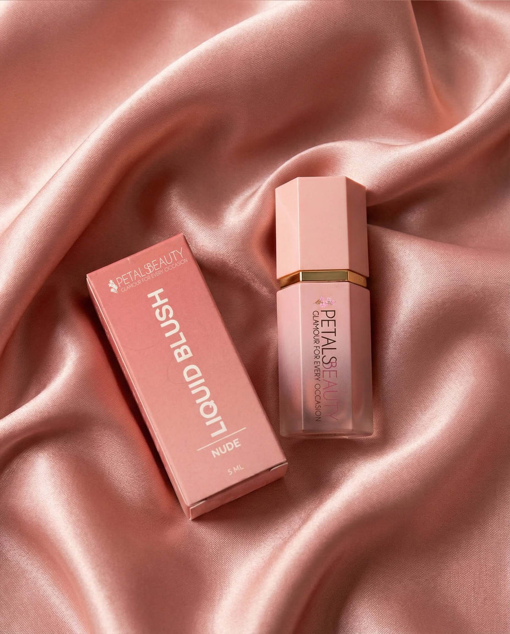 Nude liquid blush bottle open, showing the sponge-tip applicator and soft nude formula