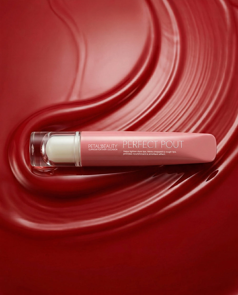 Red Ruby lip gloss with doe-foot applicator showing glossy ruby-red color