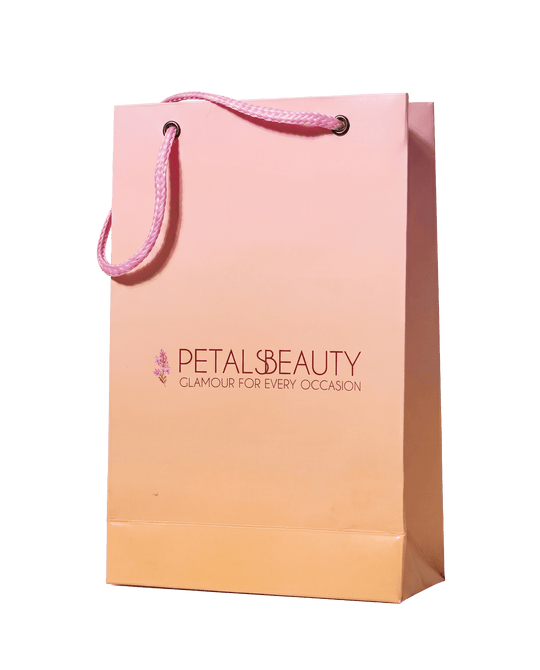 The Petals Beauty branded shopping bag on a plain background
